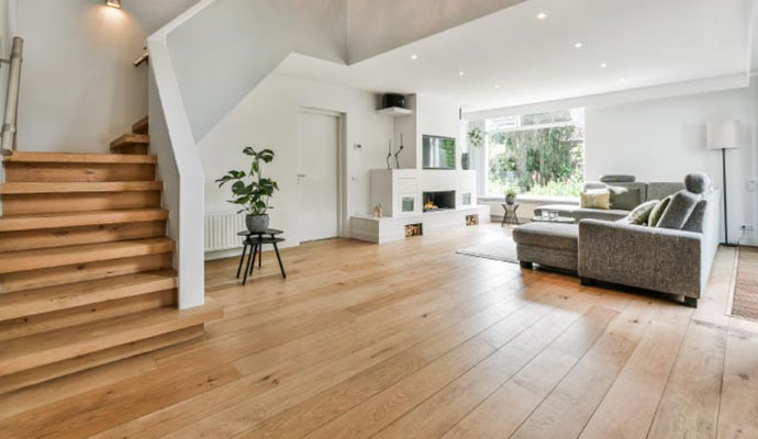 Modern living room interior with wide plank hardwood flooring
