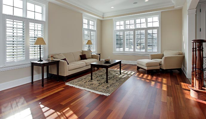 Refinished and polished hardwood floor inside living room Refinished and polished hardwood floor inside living room