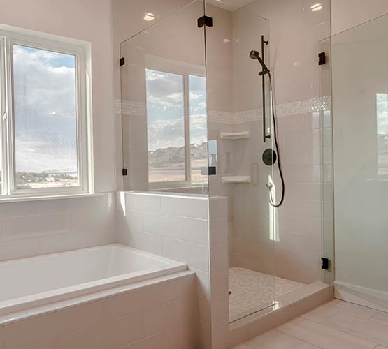Modern bathroom interior with a frameless glass shower enclosure